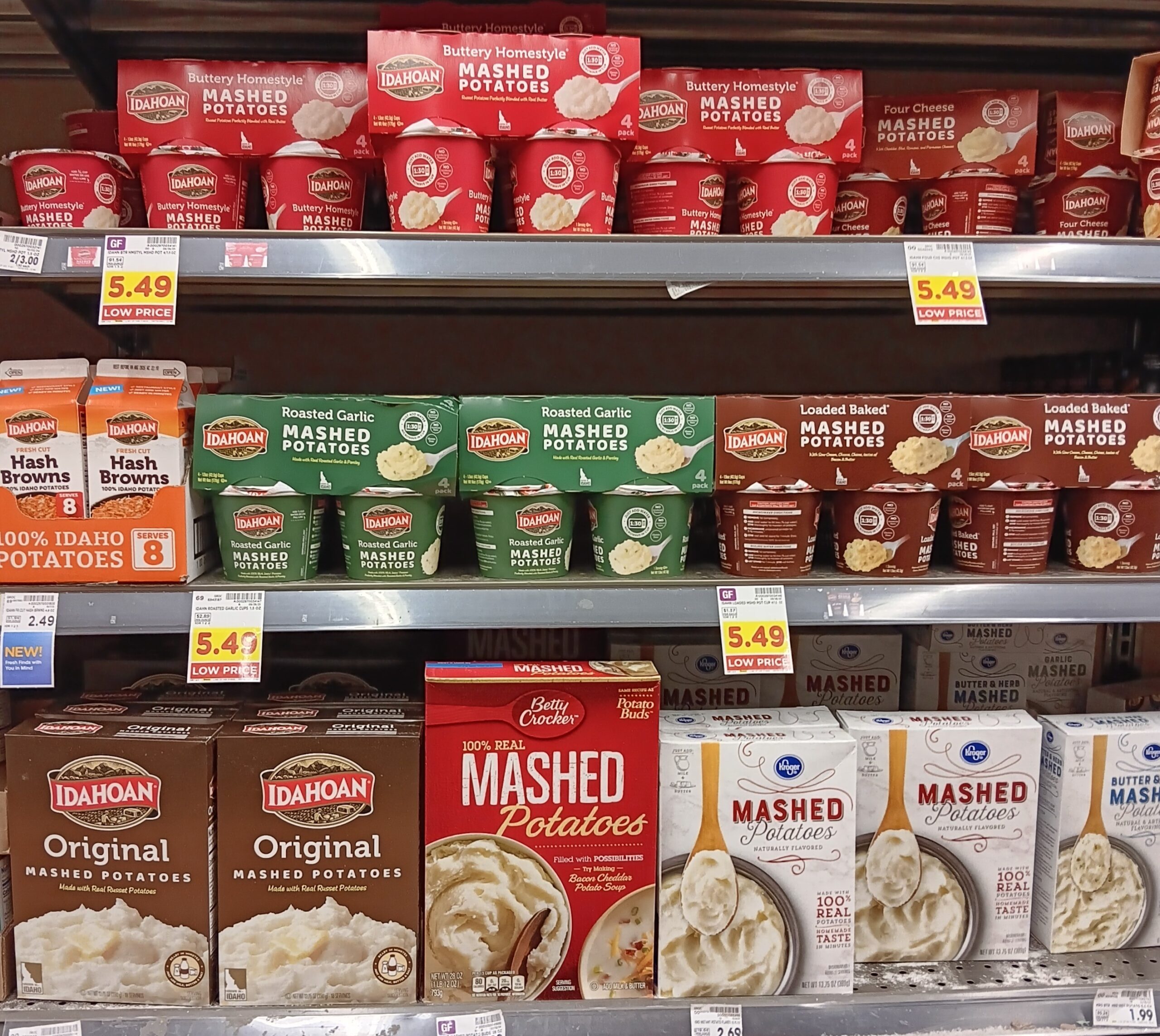 A shelf of instant potato packages at the grocery store.