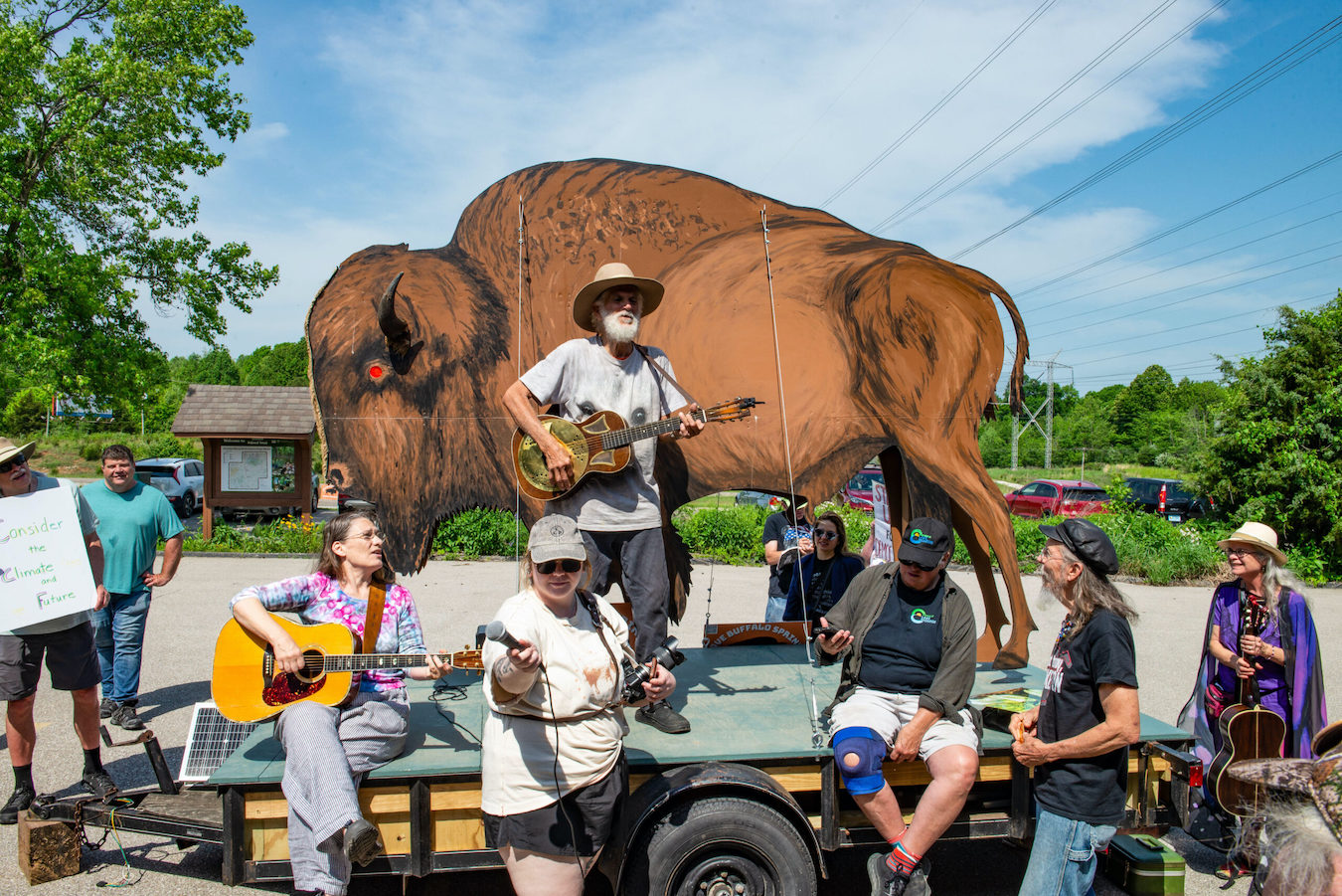Andy Mahler sings at a May 2025 protest at the U.S. Forest Service office in Bedford. | Photo by Steven Higgs