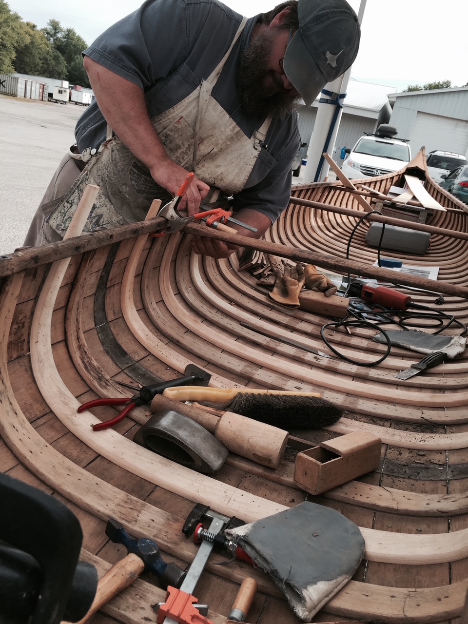 Roger Kugler fine tunes a canoe