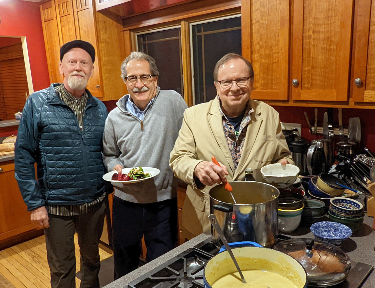 Doug McKinney, Steve Krahnke, and Bob Port dish up soup in the kitchen.