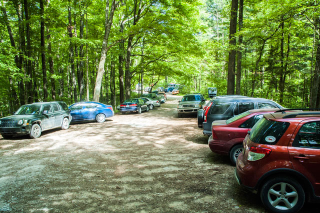 Cars crowd the parking lot at the Hickory Ridge Lookout Tower/Terrill Ridge Trailhead parking lot in the Charles C. Deam Wilderness area.