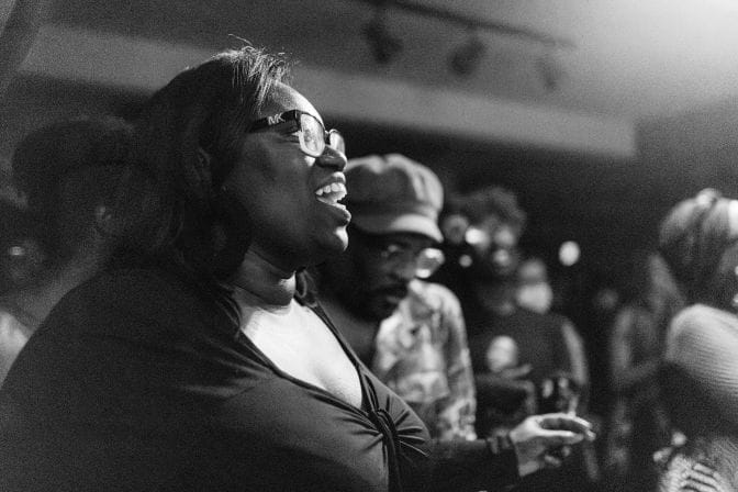 Gloria Howell, Ph.D. and director of The Neal-Marshall Black Culture Center, dances in the audience alongside Darran Mosley at the April Soul Tonk.
