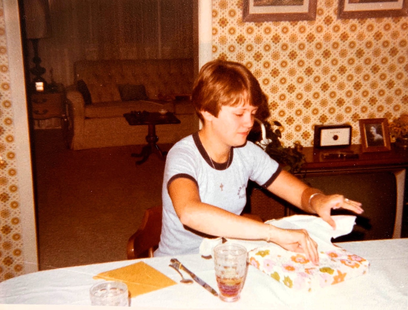 Ann Harmeier opens a present.