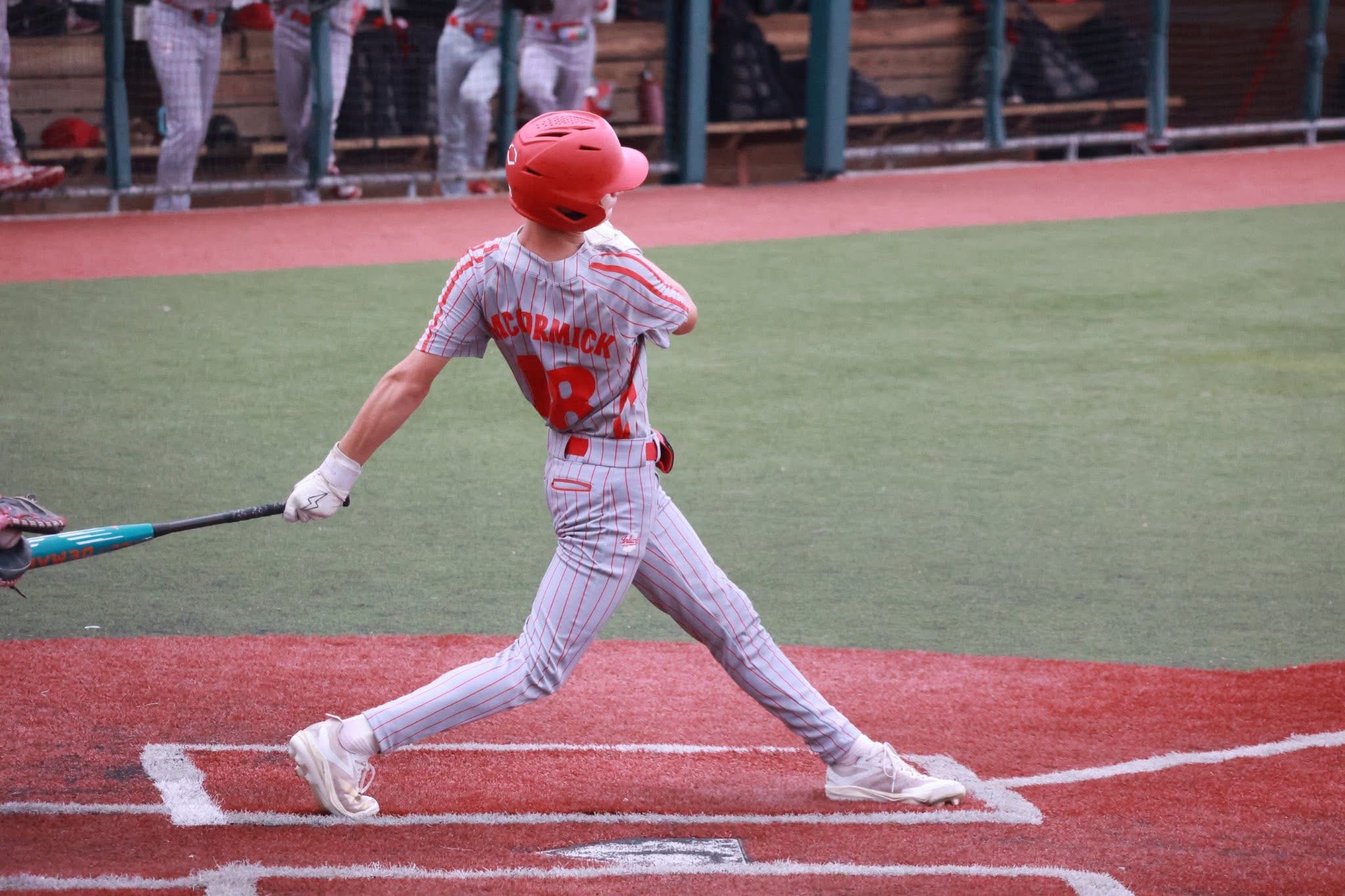 Henley McCormick swings a baseball bat.