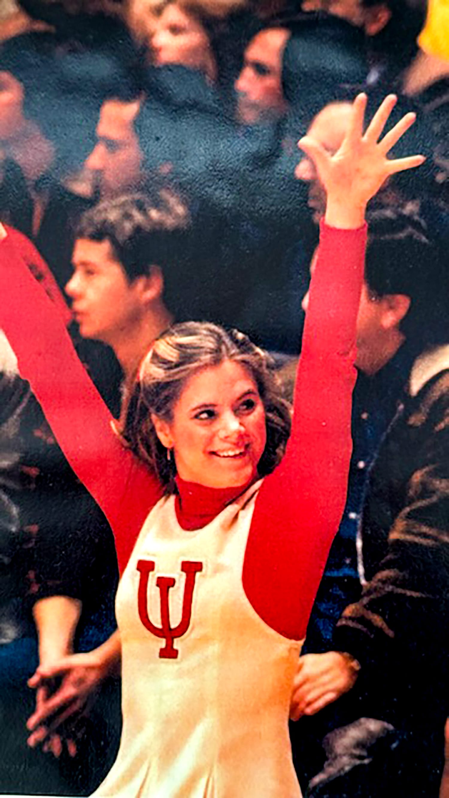Krisna Hanks wears the cream and crimson outfit of an IU pom-squad member in 1976.