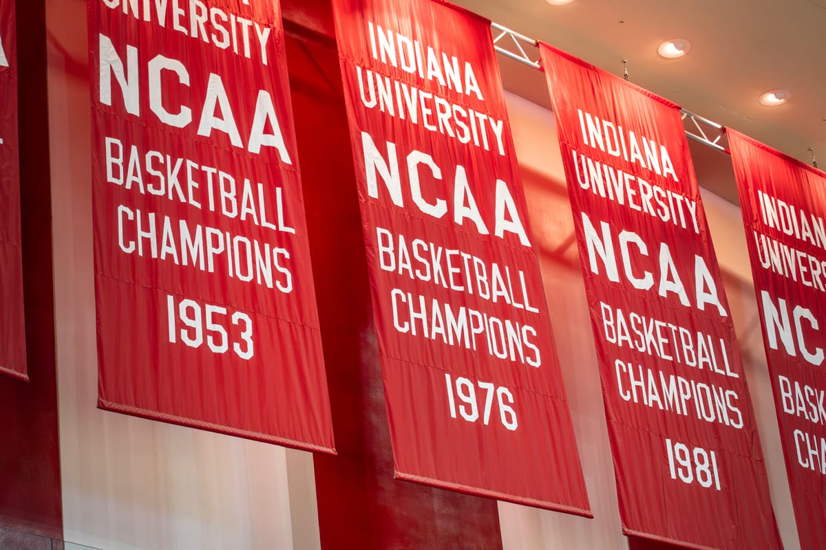 Red Indiana University NCAA Basketball Champions banners hang in Assembly Hall