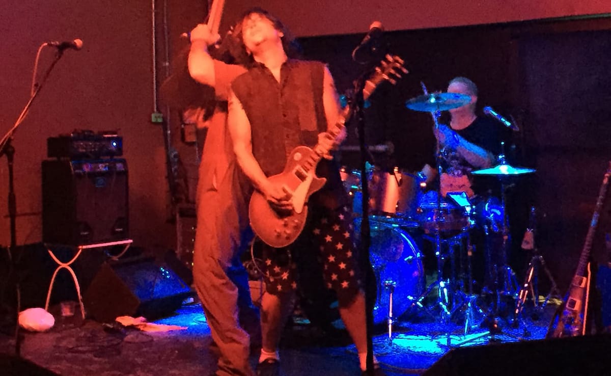 Brad Wilhelm, center, on stage at The Bishop with his band, GOUT, during their first performance. | Limestone Post