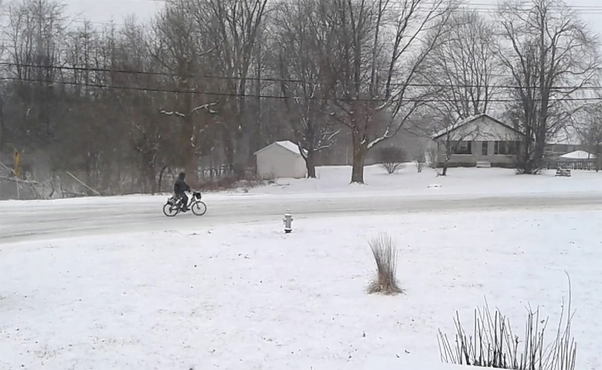 Many Monroe County residents commute to work by bike, no matter the weather. On this day in 2014, a bike commuter heads into