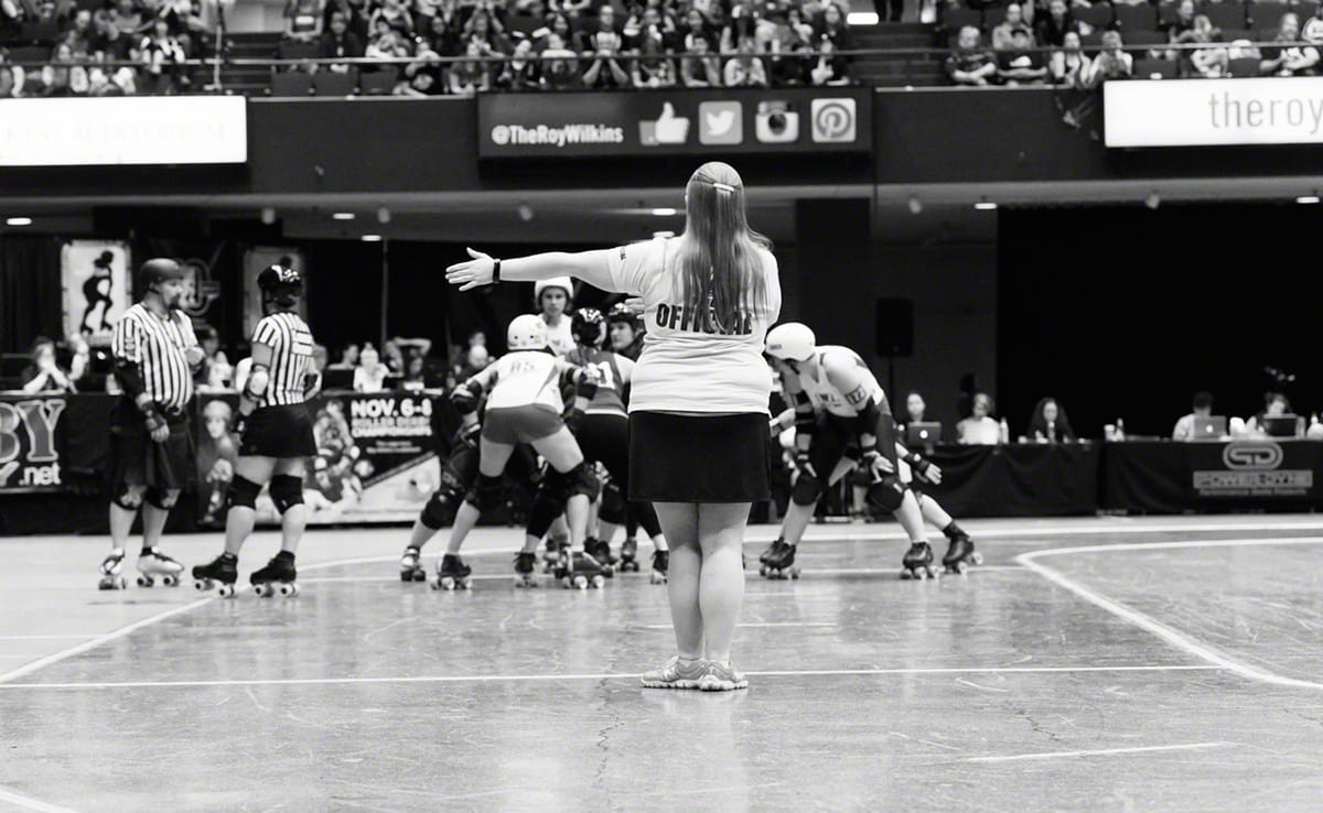 Bekka Potter, whose roller derby name is Silken Tofu, clocks a time out during the Women's Flat Track Roller Derby Associatio