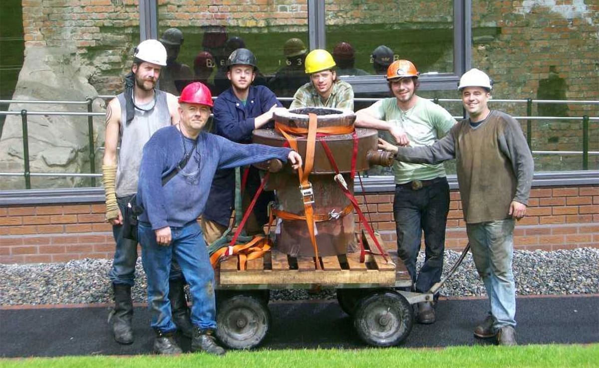 Iron casting crew in front of the historic Telford furnace in Coalbrookdale, England, at the International Conference of Cont