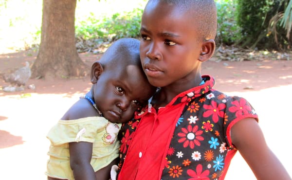 The nieces of Will’s language helper, Francis, at their house. | Photo by Will and Theresa Reed