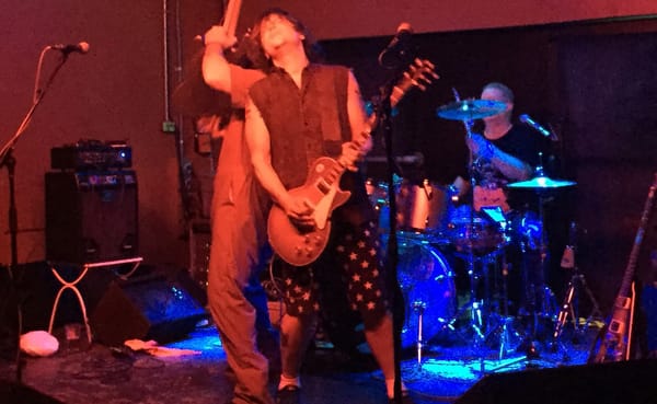 Brad Wilhelm, center, on stage at The Bishop with his band, GOUT, during their first performance. | Limestone Post