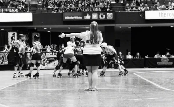 Bekka Potter, whose roller derby name is Silken Tofu, clocks a time out during the Women's Flat Track Roller Derby Associatio