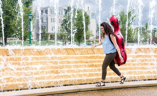Miller Susens walks through the Indiana University campus carrying her cello. Susens is studying music education in the Jacob