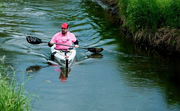 Michael Waterford paddles down the Mississippi River on one of the first few days of his attempt to break the record for a so