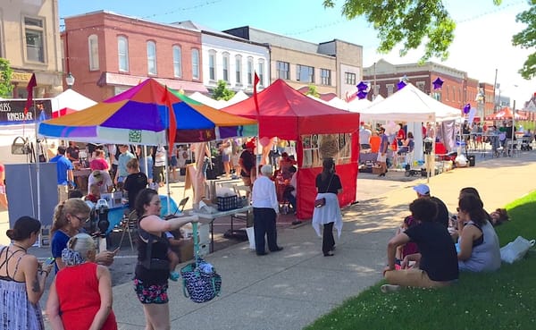 Artist tents line 6th Street in front of the Monroe County Courthouse at a previous Arts Fair on the Square. The event is ret