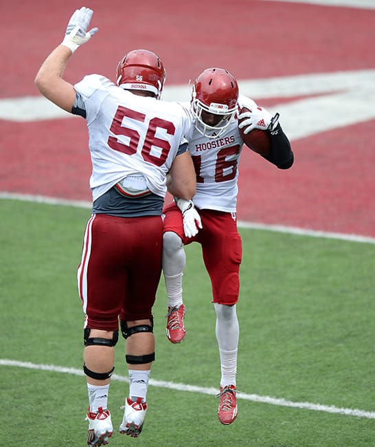 Mangieri celebrates with Rashard Fant (16) after Fant intercepted a pass during a preseason scrimmage in August. | Photo by Mike Dickbernd