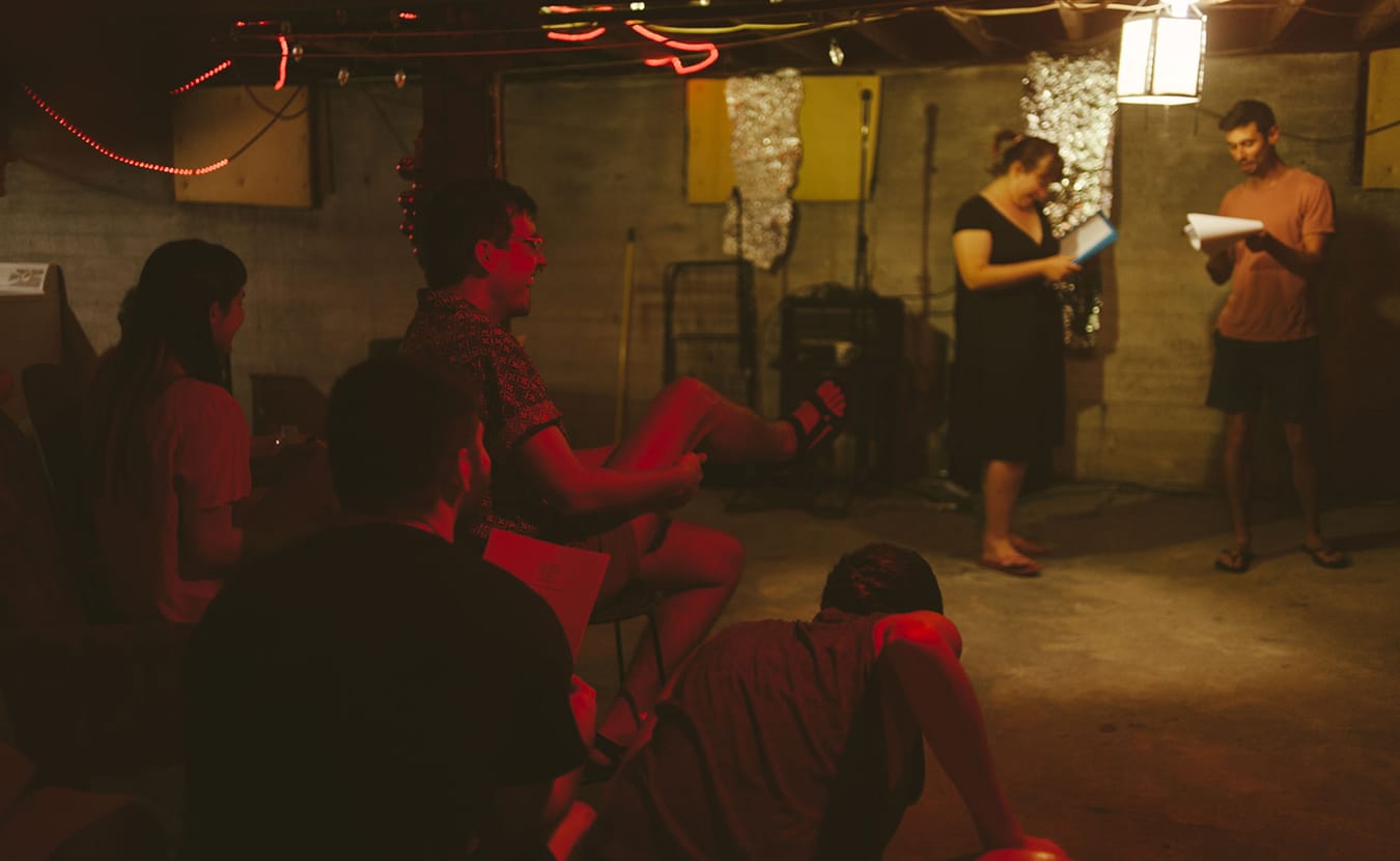 Members of Sitcom Theatre burst into laughter during a "Trading Faces" rehearsal. | Photo by Natasha Komoda