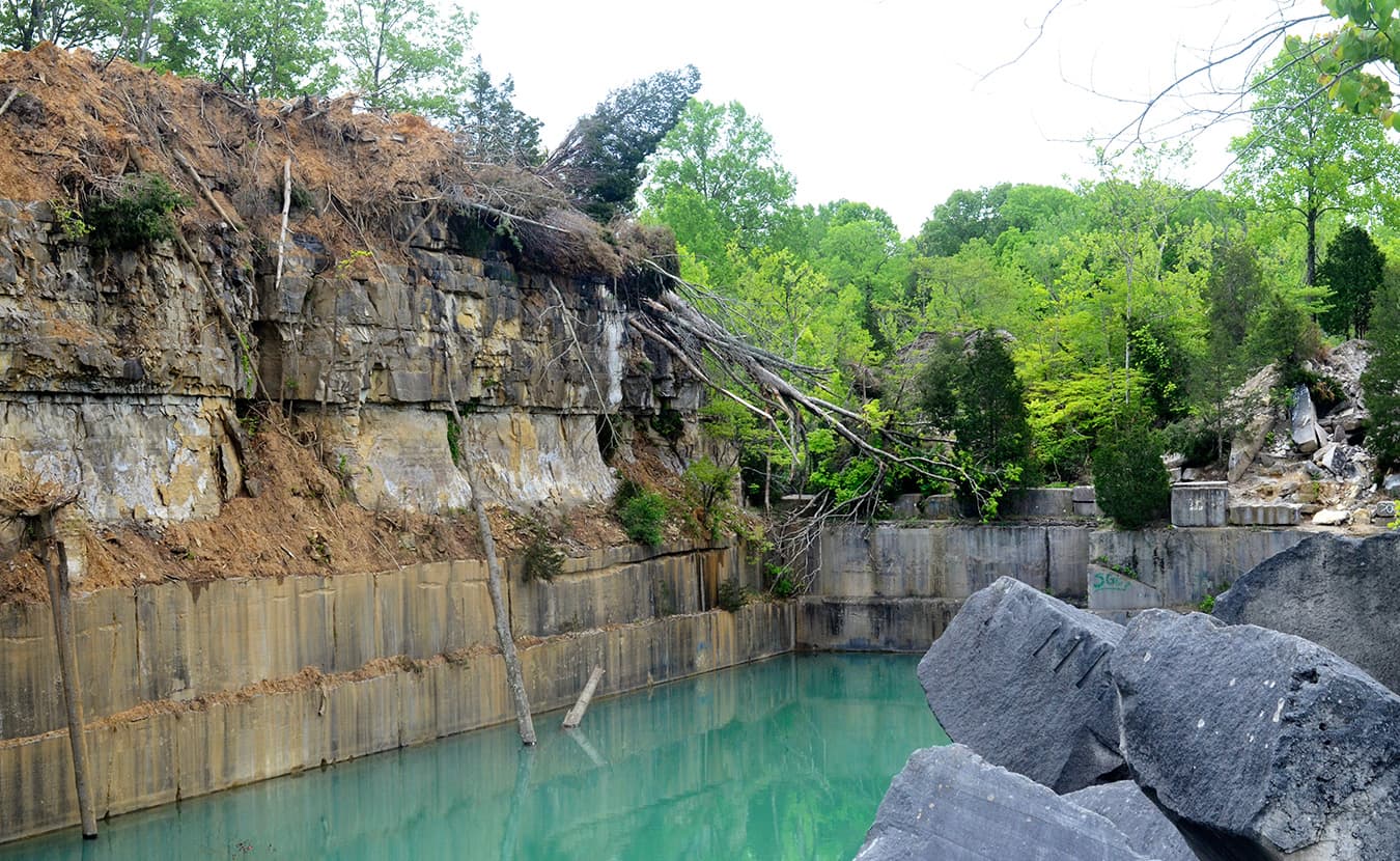 A favorite 65-foot launching point is now covered with rock, dirt, trees, and other debris — making it less accessible — in the hopes that it will deter trespassers. | Photo by Lynae Sowinski
