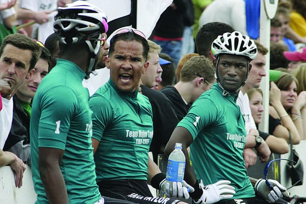Team Major Taylor cyclist Julio German speaking to teammate Steven Ballinger with Simeon Commissiong watching. Team Major Taylor brought Black students to the race, but they lost interest again after the team disbanded in 2009. | Courtesy photo
