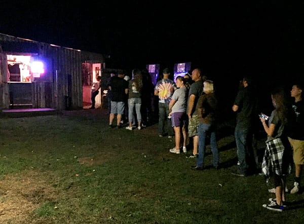 Patrons wait to enter the Barn of Terror. | Limestone Post