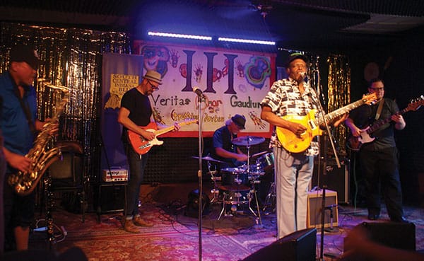 The Players Pub hosts Weekly Blues Jams every Tuesday evening. Pictured here, Bloomington blues band Fistful of Bacon performs in 2016 at the SCI Blues Society’s one-year anniversary at The Players Pub. | Photo by Sierra Vandervort