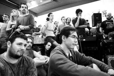 Fans watch Sonic Youth bandmembers Lee Ranaldo and Steve Shelley during an in-store performance at Landlocked in 2012. | Photo by Jeremy Hogan