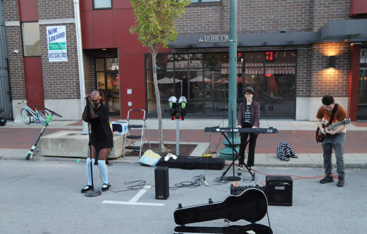 Deity Complex performed in 2021 as part of Midway Music Speaks, Battle of the Bands at the Buskirk-Chumley Theater, PrideFest, and (above) <a href="https://www.instagram.com/btownbuskatdusk/?hl=en" target="_blank"> BTownBuskAtDusk</a>. (l-r) Jae Gasana, Erby Burnfield, Bjørn Burnfield (not pictured, Erelyn Perry-Layden) | Photo by Alain Barker