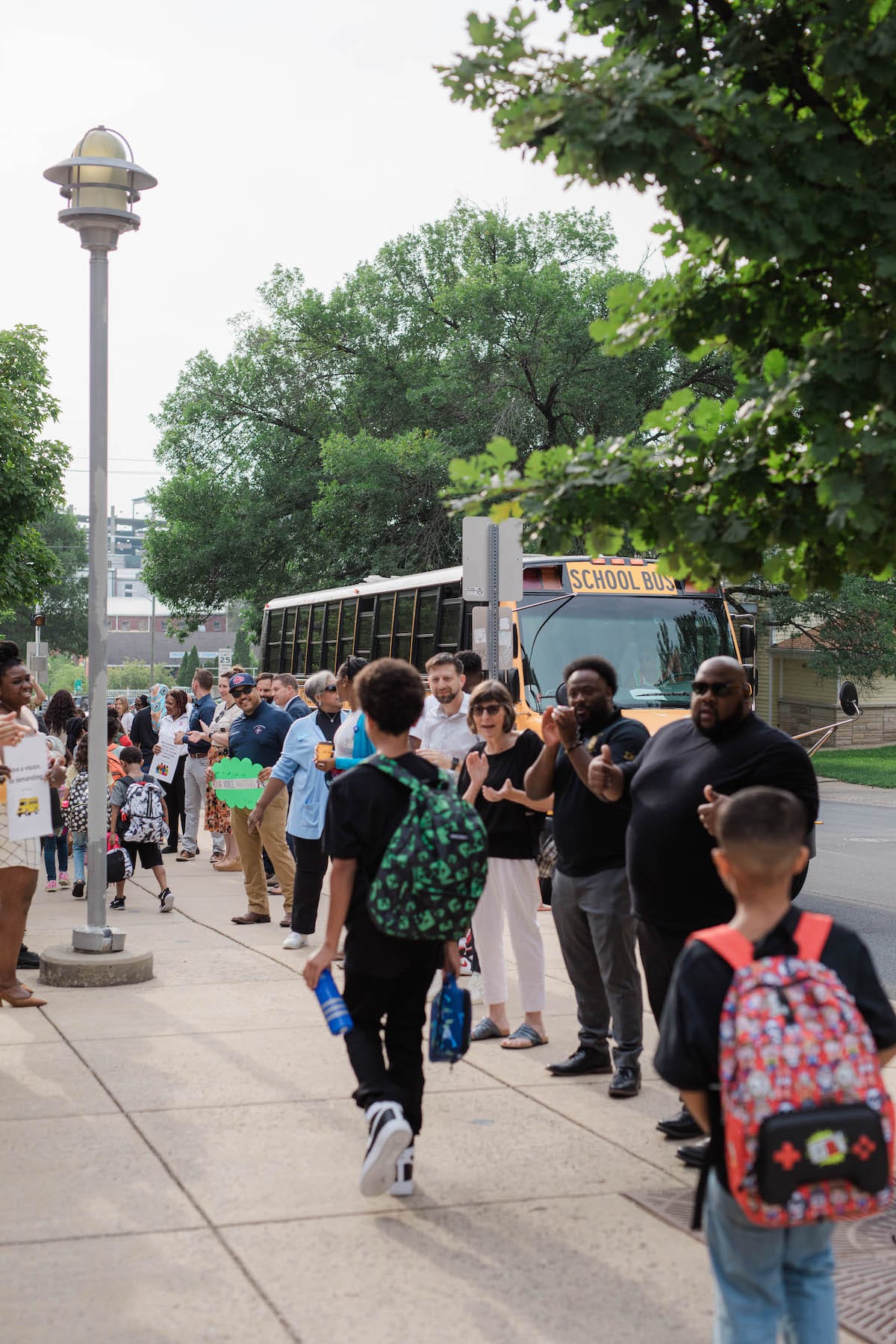 Each year on the first day of school, members of the city’s Commission on the Status of Black Males welcome students at Fairview Elementary. The event is an opportunity for “dads, uncles, grandfathers, coaches, mentors, clergy, men’s groups, and organizations to show their commitment to the educational lives of their children and children in the community,” according to the group’s <a href="https://bloomington.in.gov/boards/status-of-black-males" target="_blank">website</a> | Photo by Garrett Ann Walters