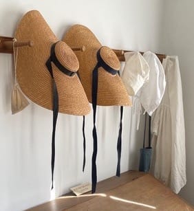 Harmonist-style clothes on pegs inside the David Lenz House. | Photo by Laurie D. Borman
