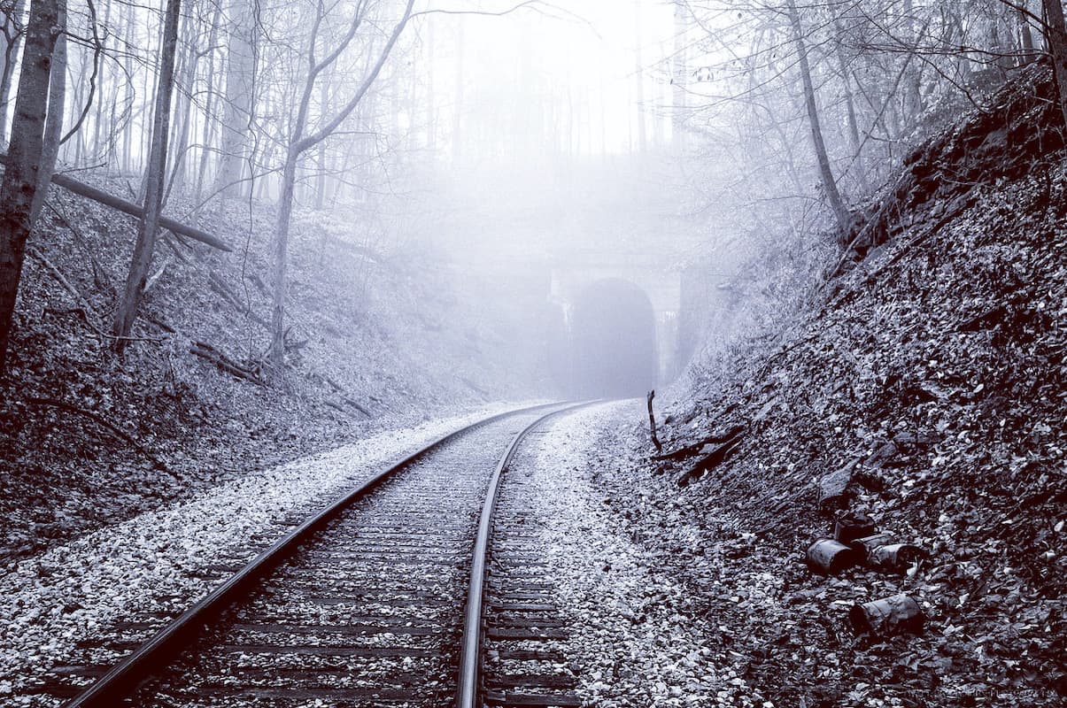 Tunnel Road tunnel — The tunnel this morning was perfect. It is very close to my home and I can walk to it. The fog was thick and I had a feeling it would bring about what I could see in my mind as the shot I wanted. I thought that it would enhance the feeling by giving it a black and white filter.