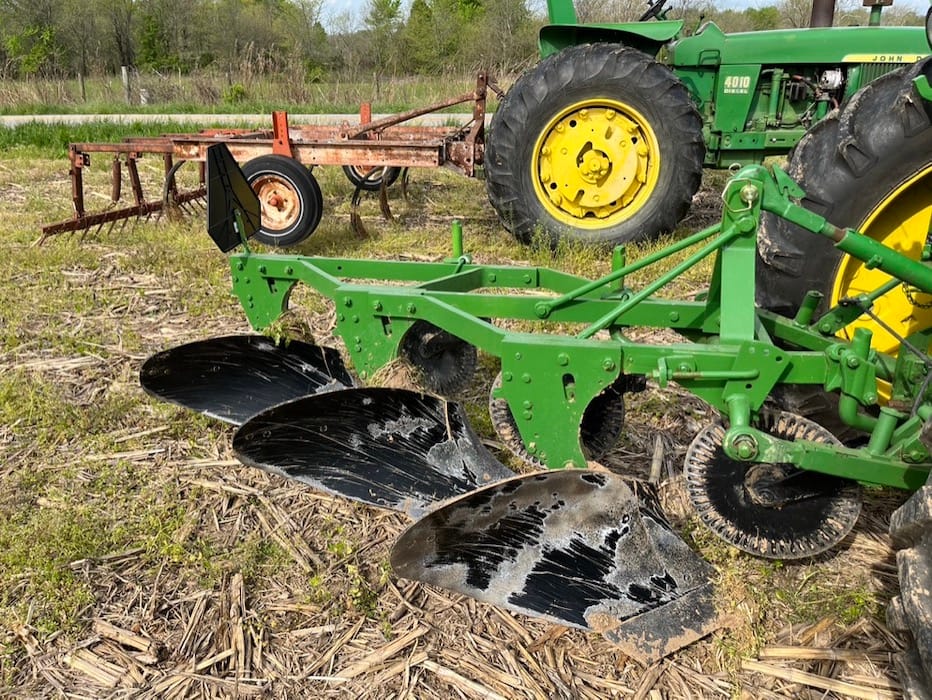 Equipment of any age can be part of the Monroe County Antique Machinery Association. In the background is a chisel plow and in the foreground a moldboard plow.