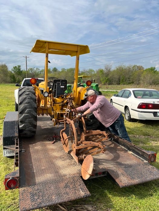 Kevin Zikes unloads his equipment for plow day.